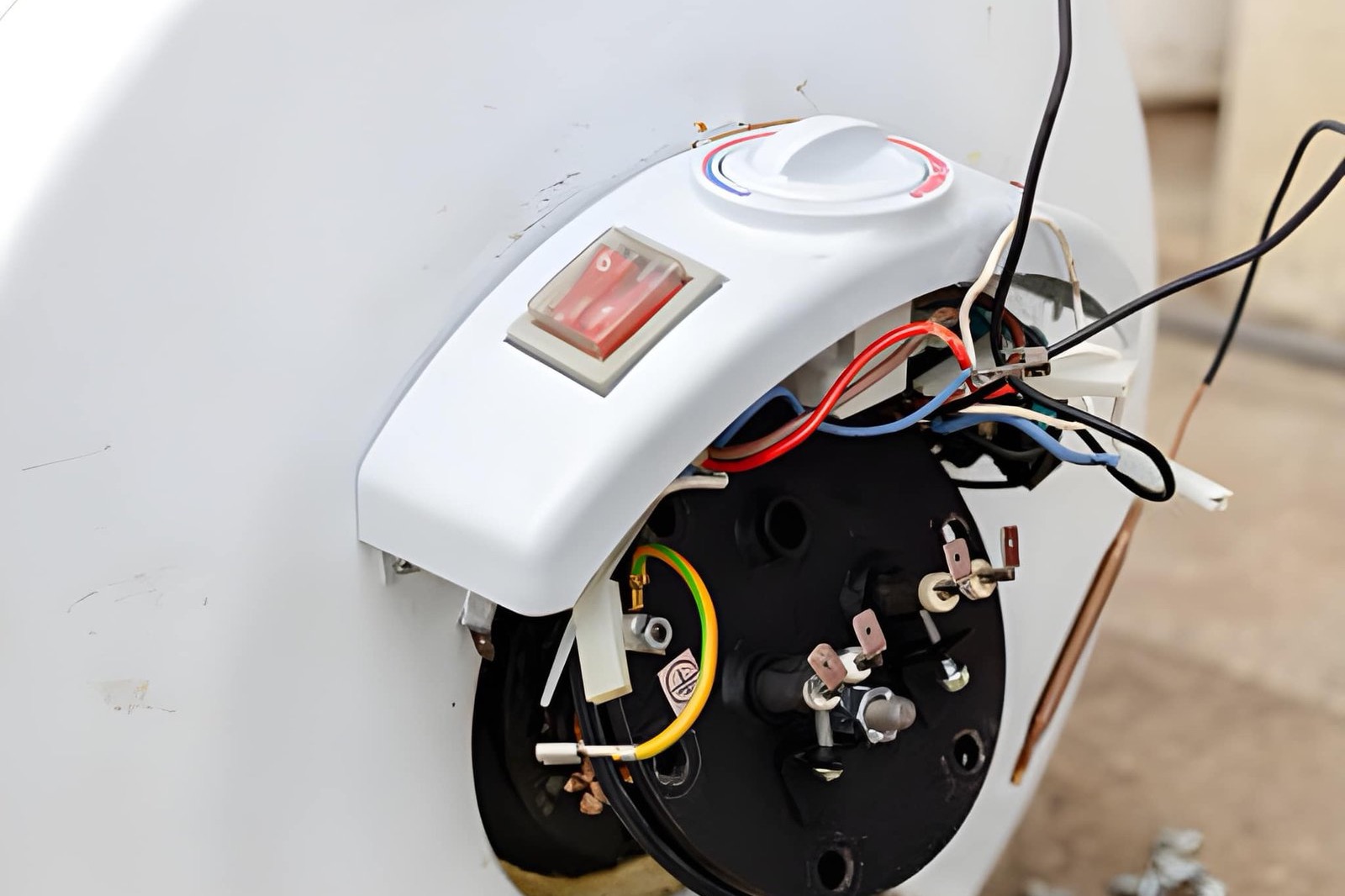 Hot water cylinder element flange and wiring exposed during replacement